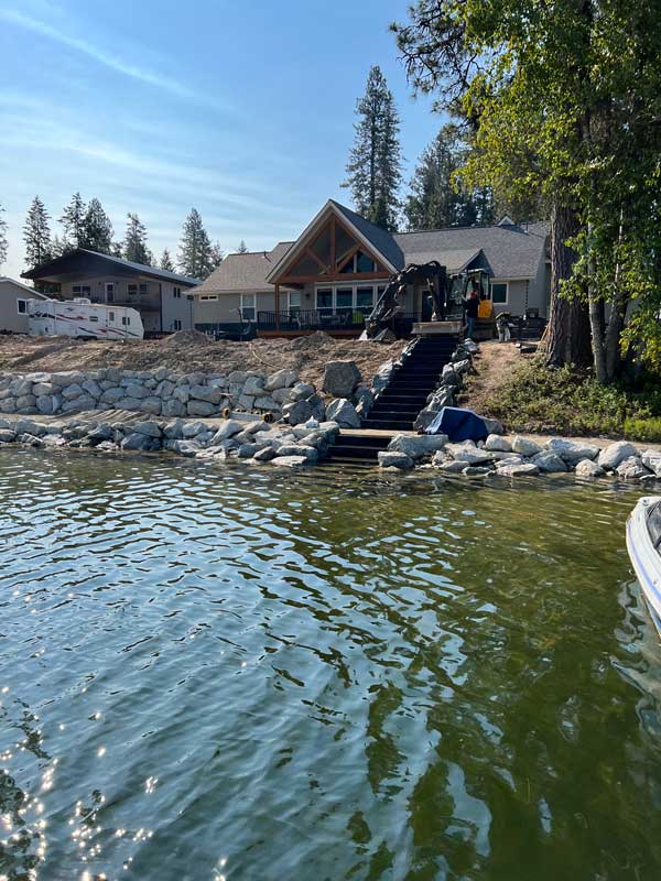 backyard area over a river with a backyard lawn prepped for installation